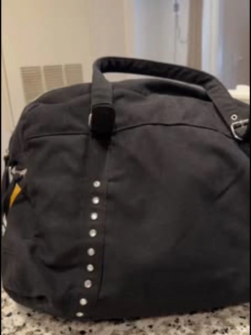 Black Stud-Accent woman’s Travel Duffel Bag